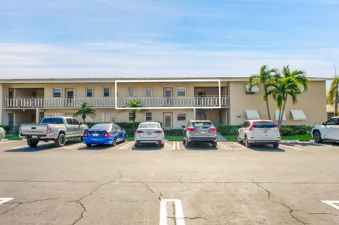 an aerial view of a house with garden space and street view