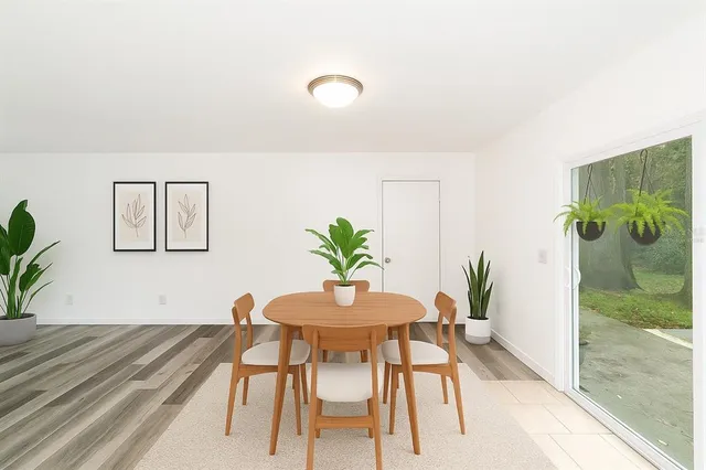 a view of yard with tree and wooden fence