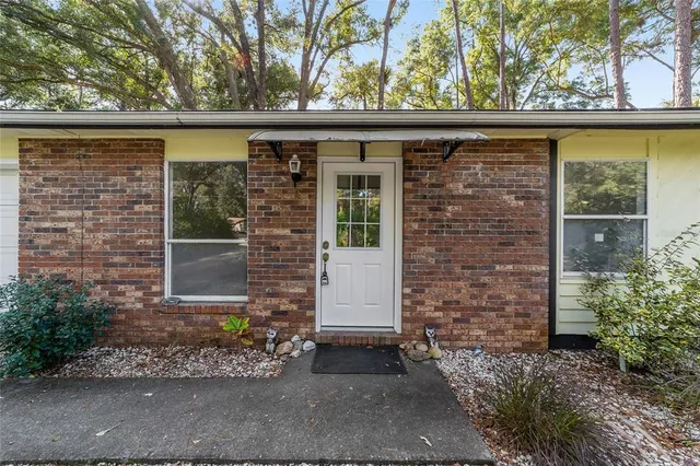 a large kitchen with cabinets appliances and a counter space
