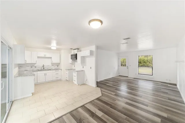 a bathroom with a sink mirror toilet and bathtub
