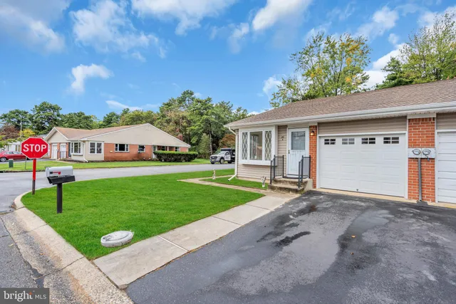 a view of an house with backyard space and garden