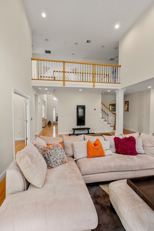 21 Whispering Lane Natick, MA 01760 - Photo 12 of 41 a bedroom with furniture and a book shelf