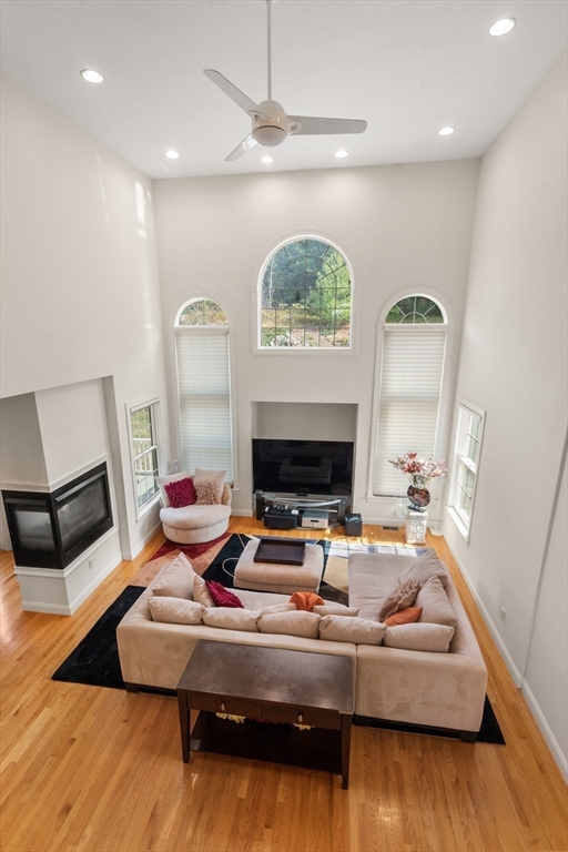 21 Whispering Lane Natick, MA 01760 - Photo 13 of 41 a room with furniture and a flat screen tv