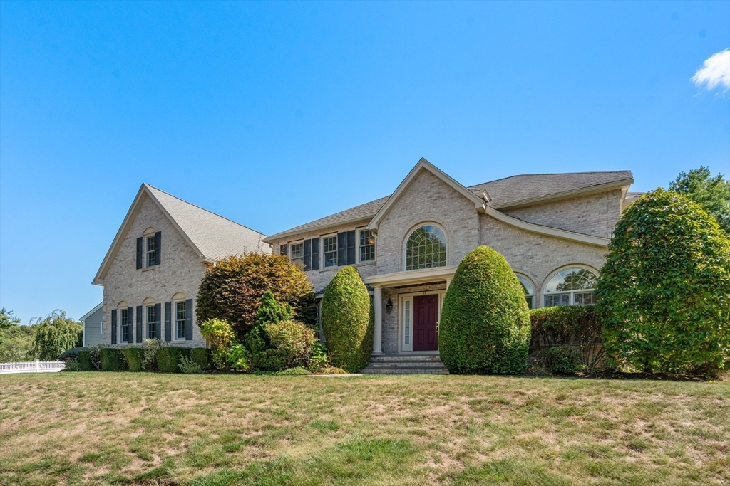 21 Whispering Lane Natick, MA 01760 - Photo 2 of 41 a view of a white house with a yard and plants