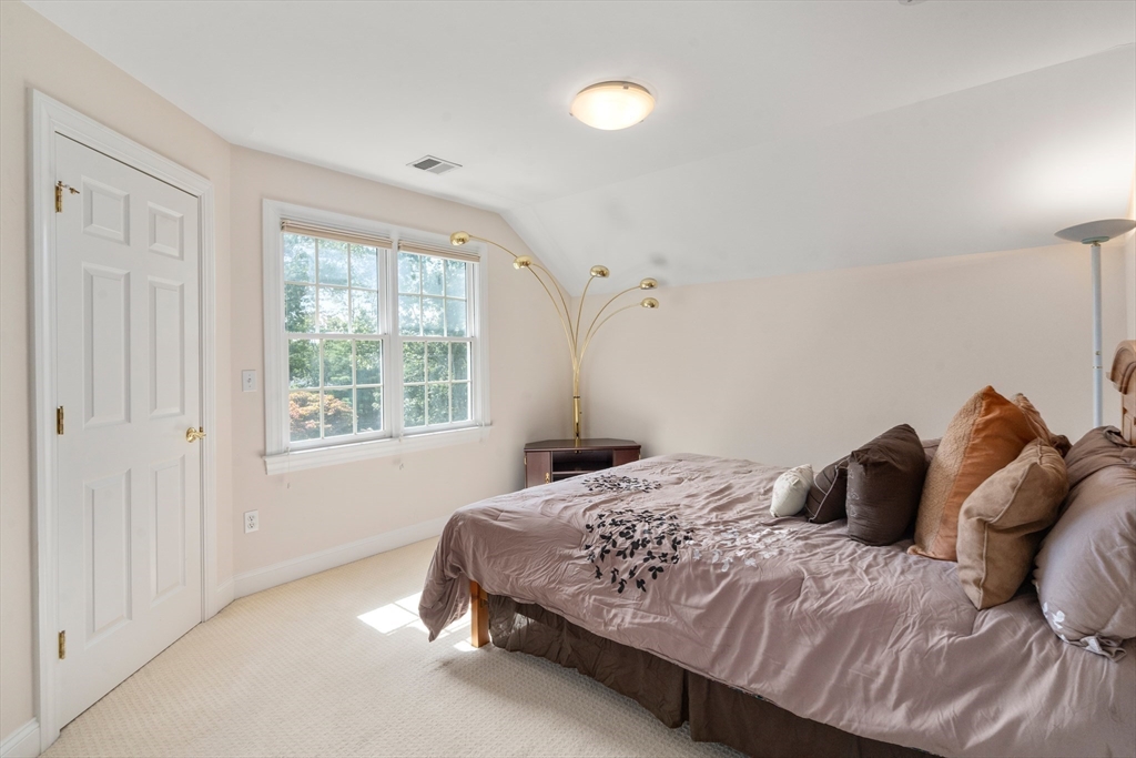 21 Whispering Lane Natick, MA 01760 - Photo 25 of 41 a bedroom with a bed and window