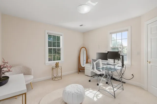 a work room with furniture and windows