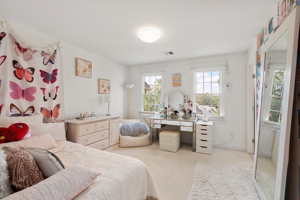 21 Whispering Lane Natick, MA 01760 - Photo 28 of 41 a bedroom with a bed and a couch