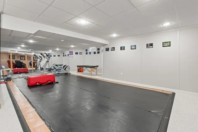 an empty room with lots of wooden furniture