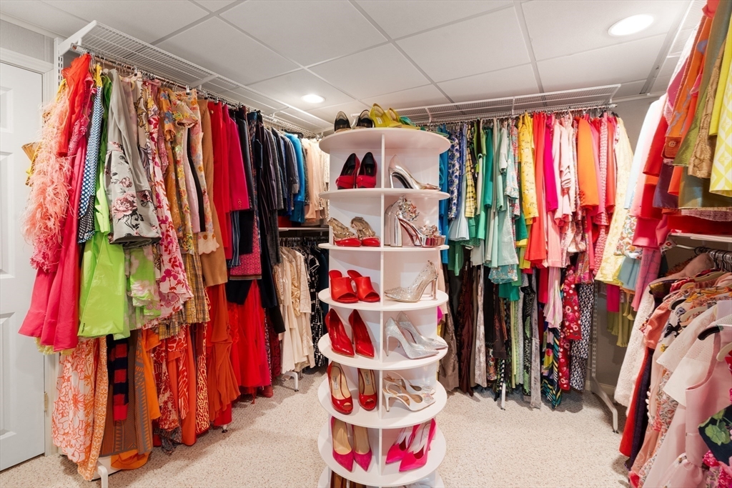 21 Whispering Lane Natick, MA 01760 - Photo 32 of 41 a view of walk in closet with clothes