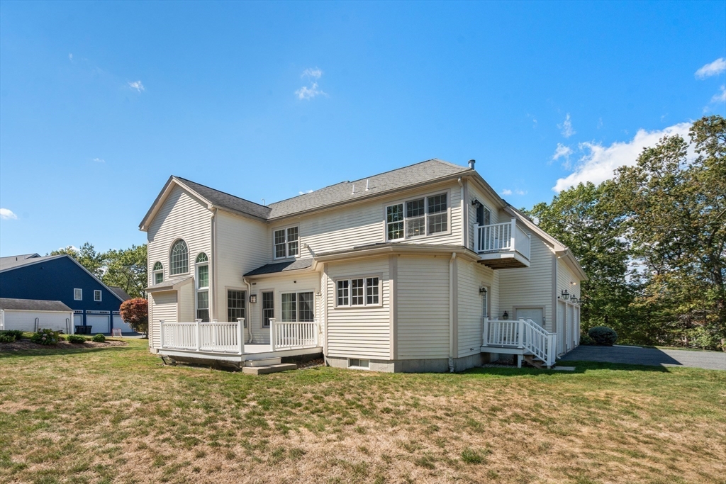 21 Whispering Lane Natick, MA 01760 - Photo 37 of 41 a view of a house with a yard
