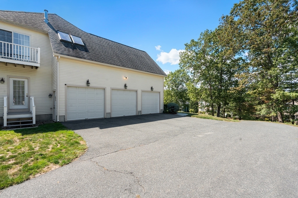 21 Whispering Lane Natick, MA 01760 - Photo 38 of 41 a view of a backyard of a house
