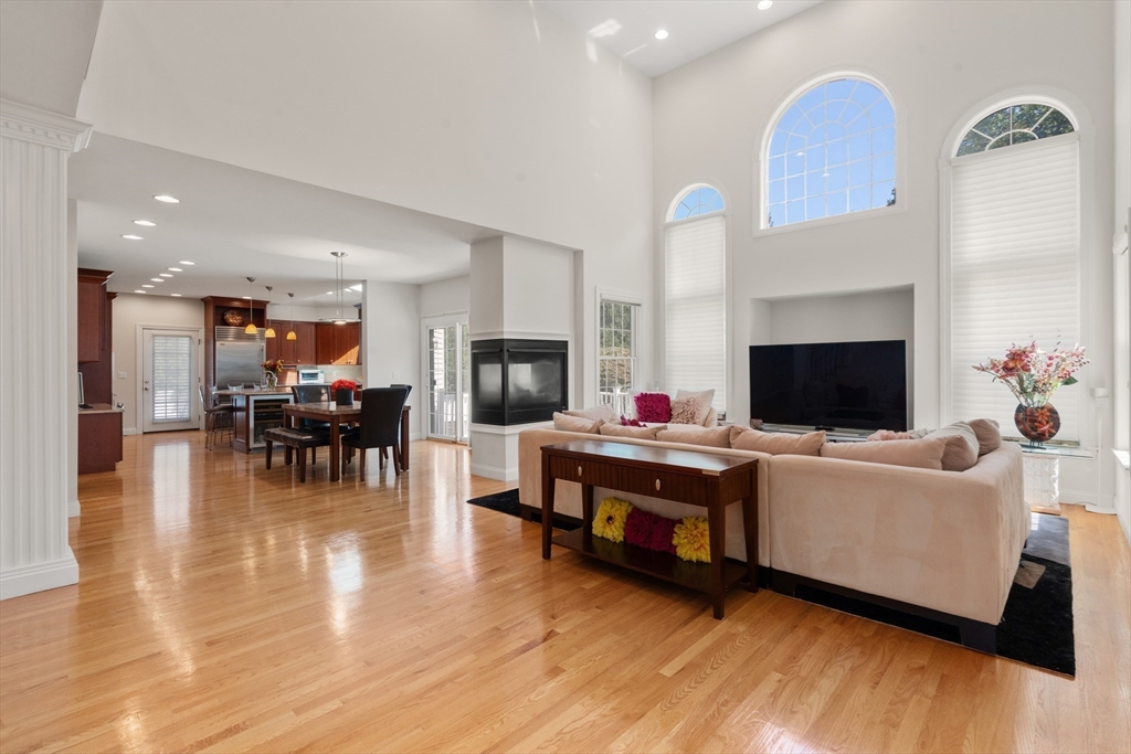21 Whispering Lane Natick, MA 01760 - Photo 9 of 41 a living room with furniture and a flat screen tv