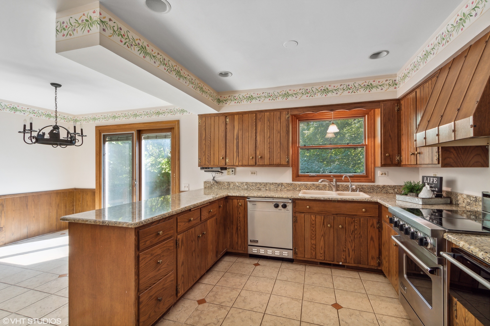 322 Old Sutton Road Barrington, IL 60010 - Photo 3 of 37 a kitchen with stainless steel appliances granite countertop a sink stove and cabinets