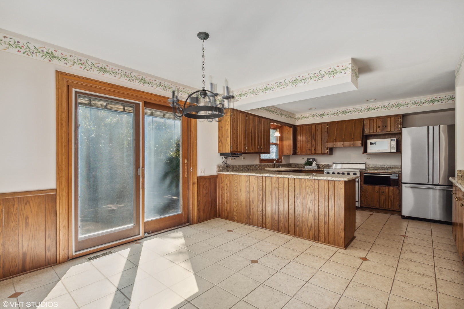 322 Old Sutton Road Barrington, IL 60010 - Photo 4 of 37 a kitchen with stainless steel appliances kitchen island granite countertop a refrigerator a stove and a sink