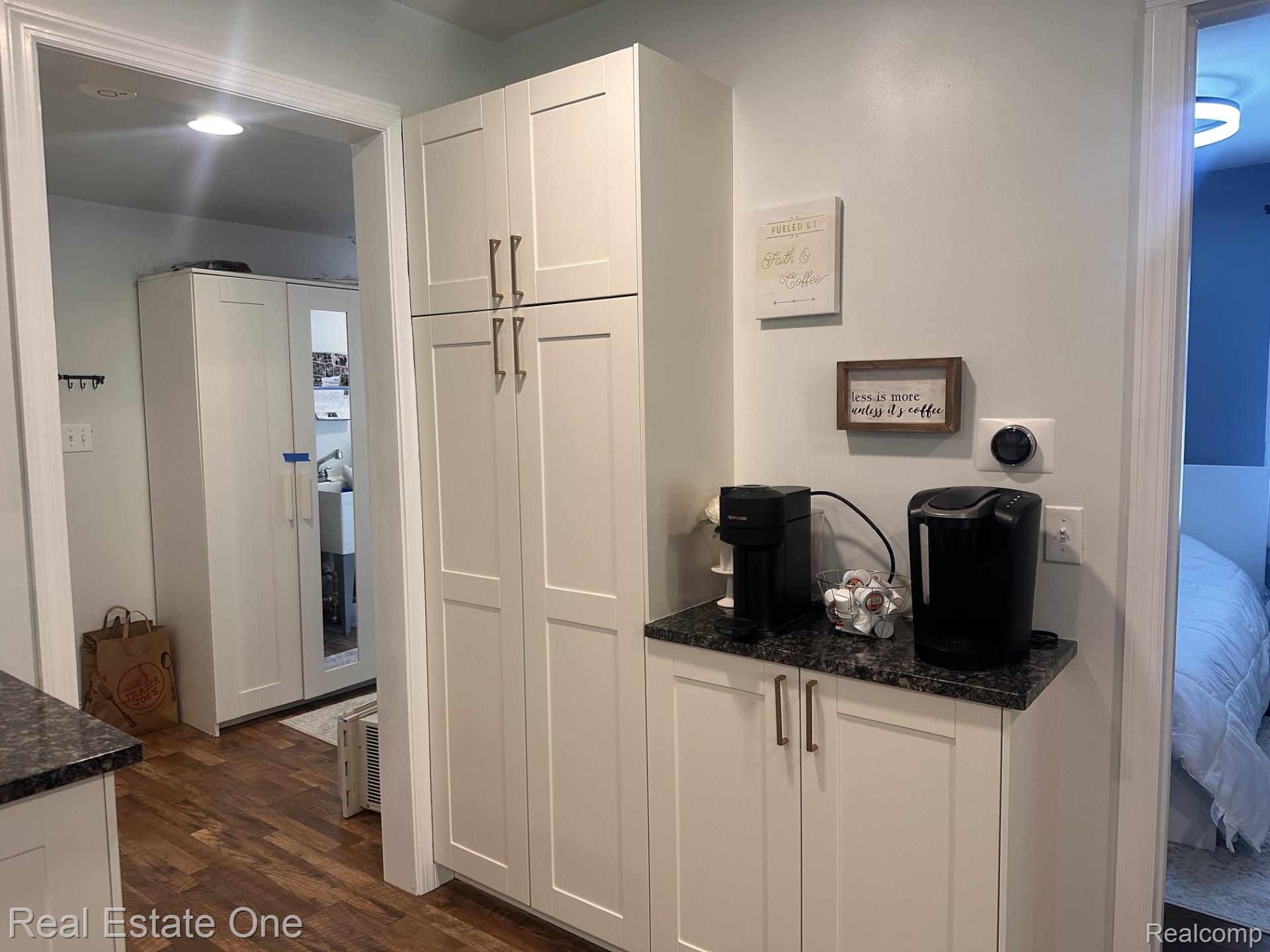 2073 Roslyn Road Grosse Pointe, MI 48236 - Photo 13 of 30 Abundance of newer cabinets with lovely hardware in the spacious kitchen.