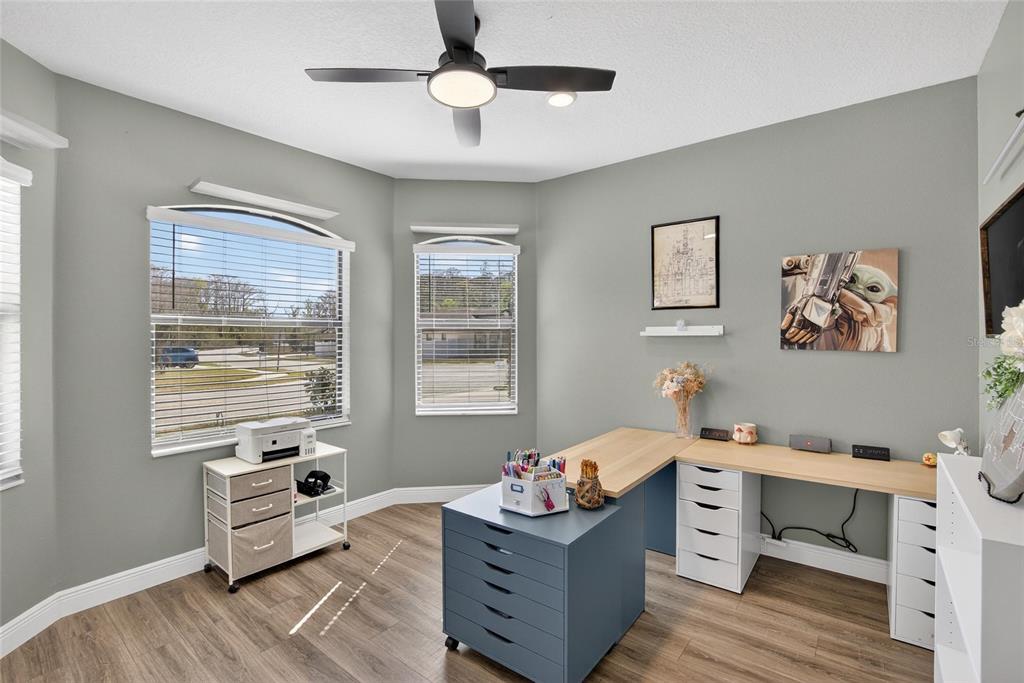 11439 Crowne Pointe Street New Port Richey, FL 34654 - Photo 13 of 50 a bedroom with furniture and window