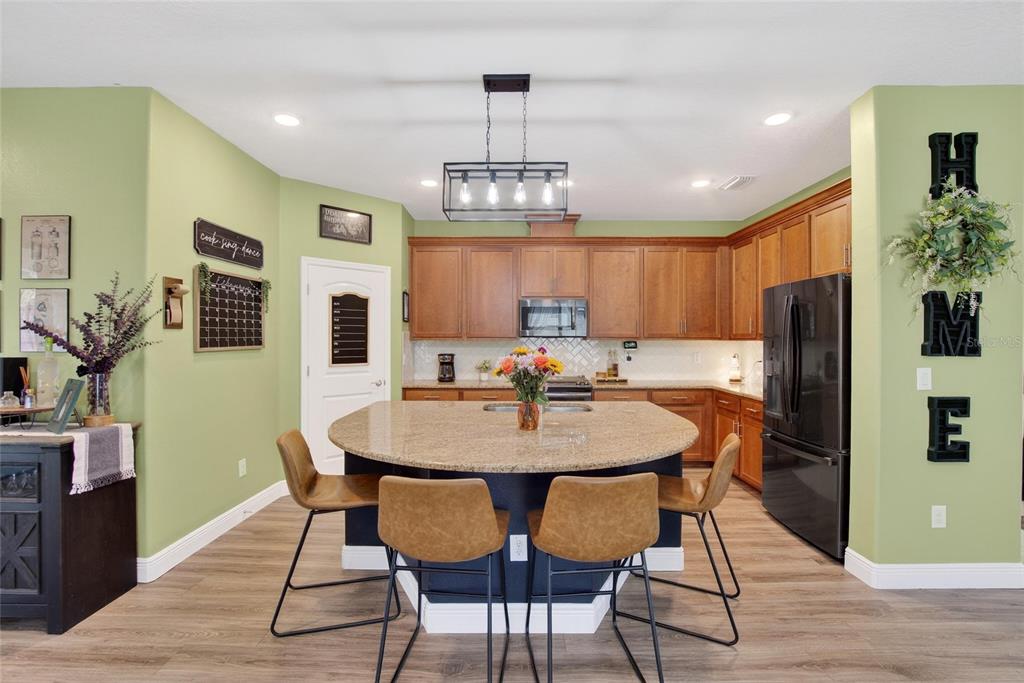 11439 Crowne Pointe Street New Port Richey, FL 34654 - Photo 19 of 50 a view of a dining room with furniture window and wooden floor