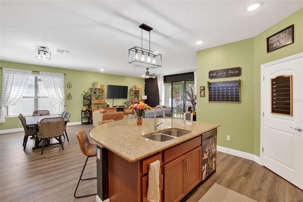 11439 Crowne Pointe Street New Port Richey, FL 34654 - Photo 22 of 50 a view of a dining room with furniture window and wooden floor