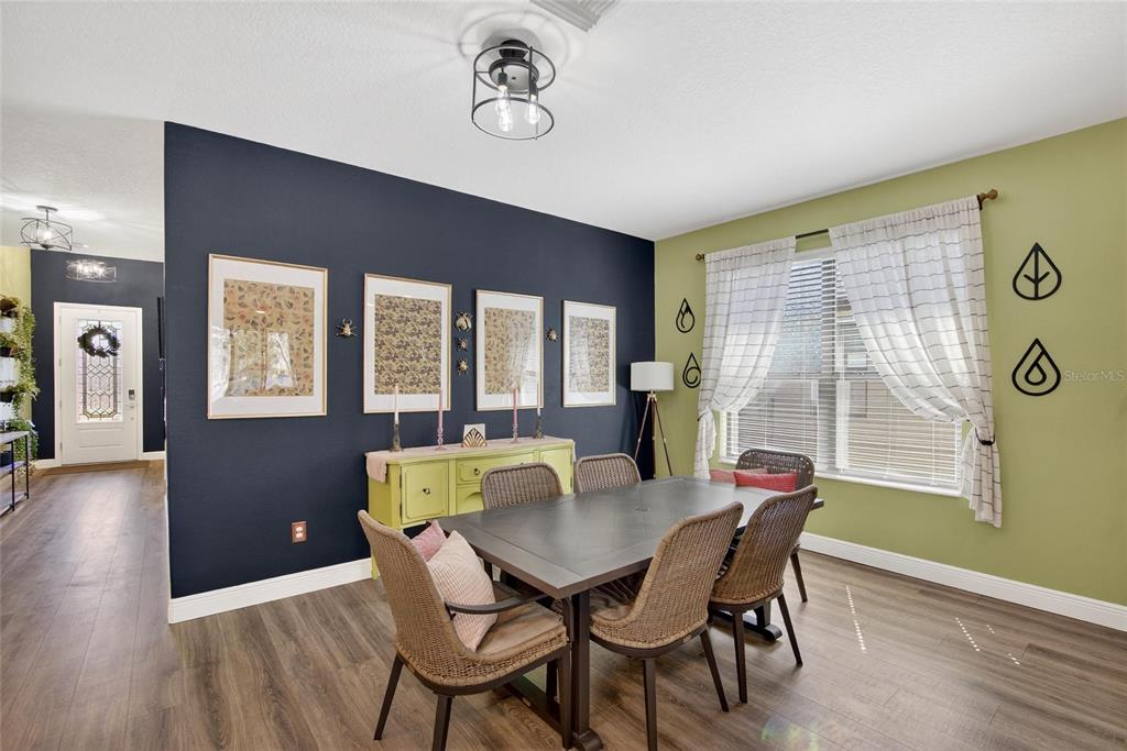 11439 Crowne Pointe Street New Port Richey, FL 34654 - Photo 24 of 50 a view of a dining room with furniture and window