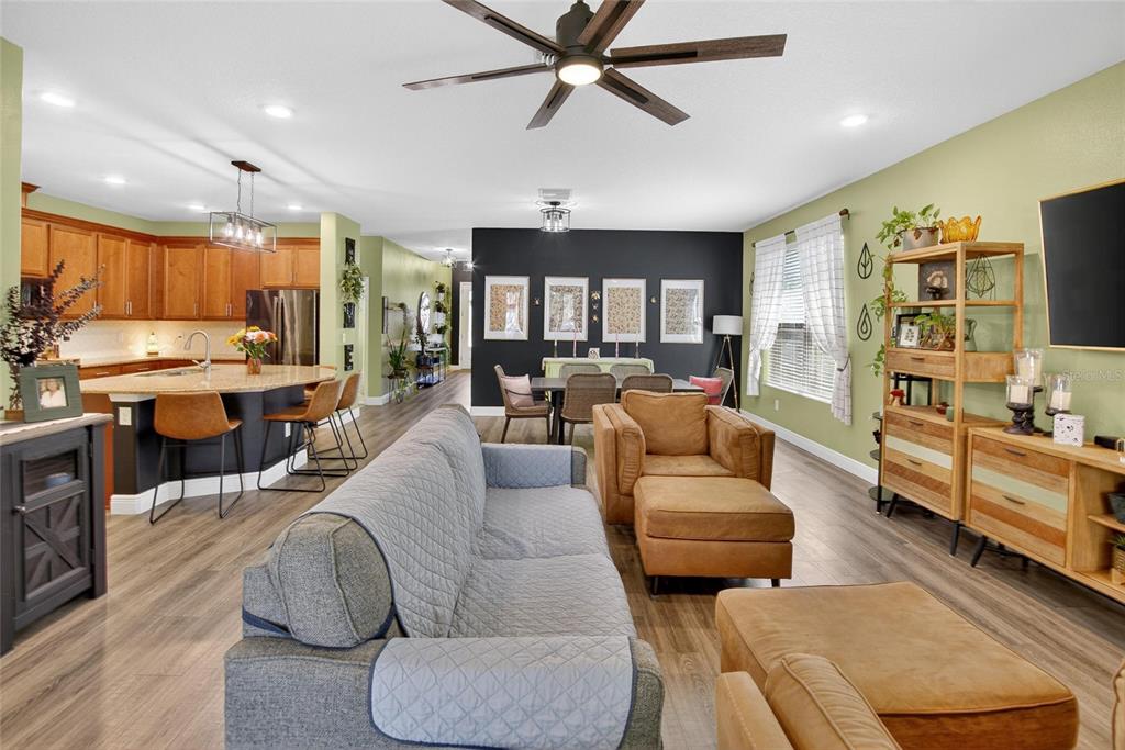 11439 Crowne Pointe Street New Port Richey, FL 34654 - Photo 29 of 50 a living room with furniture kitchen view and a large window