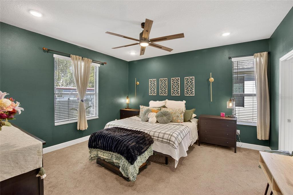 11439 Crowne Pointe Street New Port Richey, FL 34654 - Photo 30 of 50 a bedroom with a large bed and a window