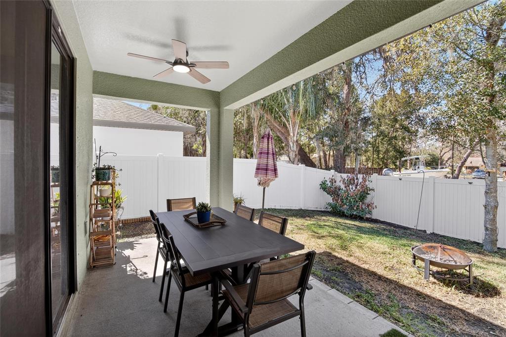11439 Crowne Pointe Street New Port Richey, FL 34654 - Photo 37 of 50 a view of a dining room with furniture and a large window