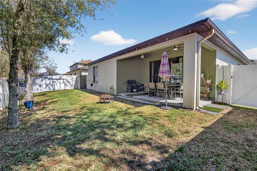 11439 Crowne Pointe Street New Port Richey, FL 34654 - Photo 39 of 50 a view of a house with a big yard