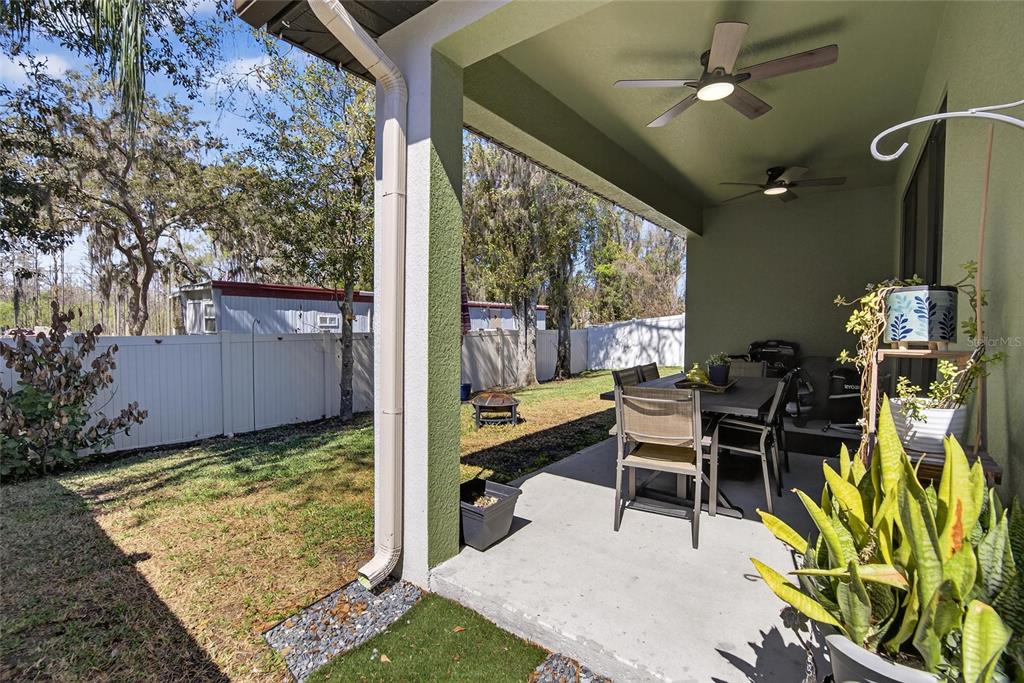 11439 Crowne Pointe Street New Port Richey, FL 34654 - Photo 40 of 50 a outdoor dining space with furniture