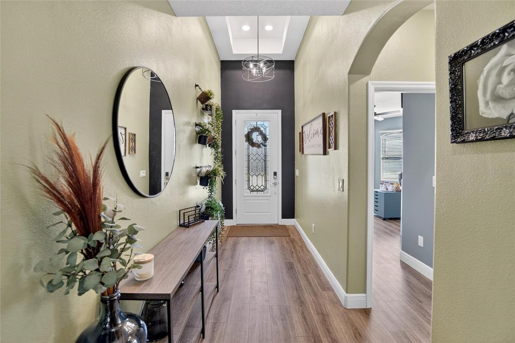 11439 Crowne Pointe Street New Port Richey, FL 34654 - Photo 5 of 50 a view of a entryway door with wooden floor