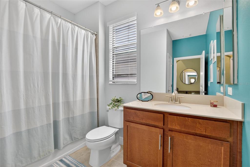 11439 Crowne Pointe Street New Port Richey, FL 34654 - Photo 7 of 50 a bathroom with a sink vanity mirror and toilet
