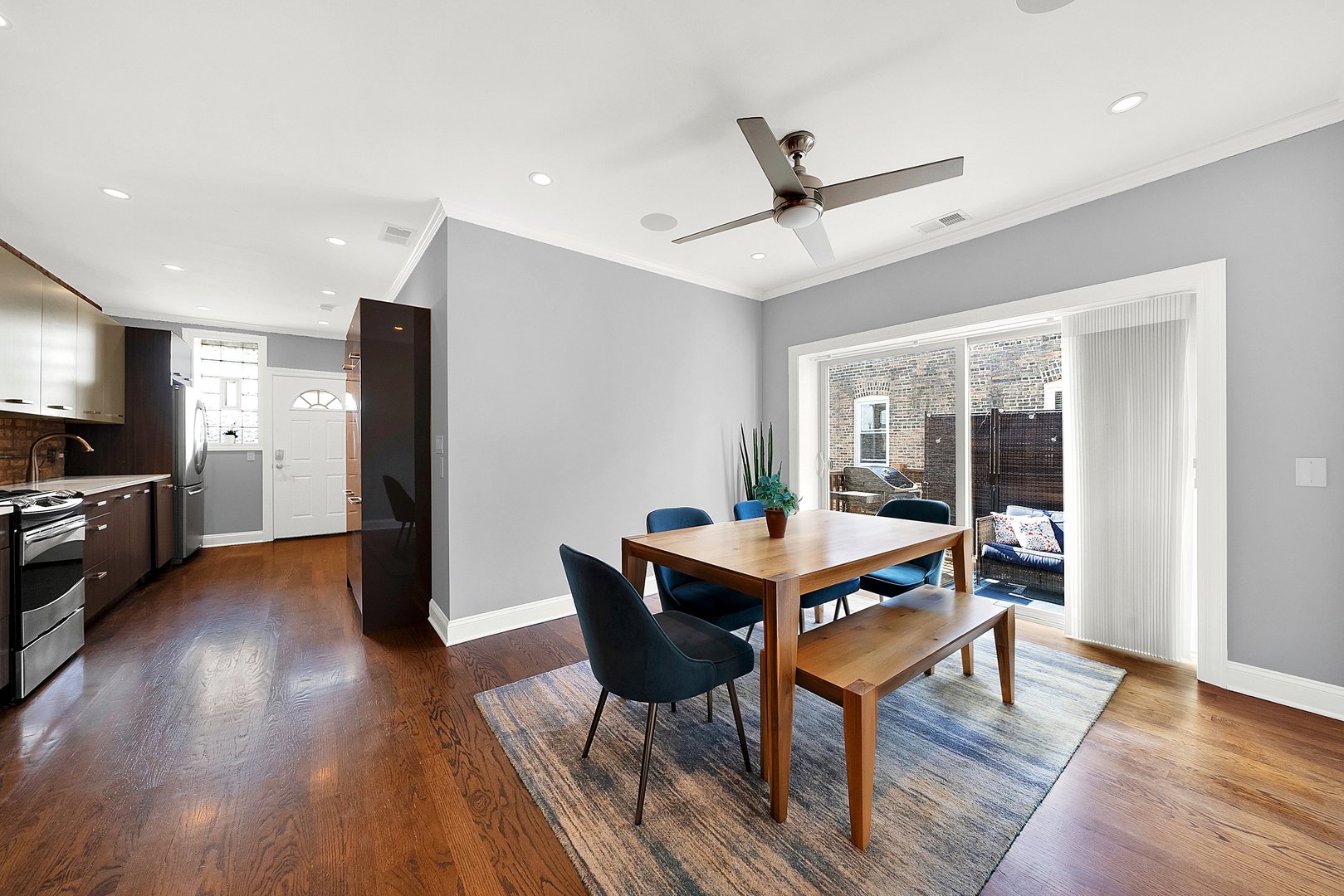 Undisclosed Address Chicago, IL 60647 - Photo 4 of 10 a dining room with furniture a rug and wooden floor