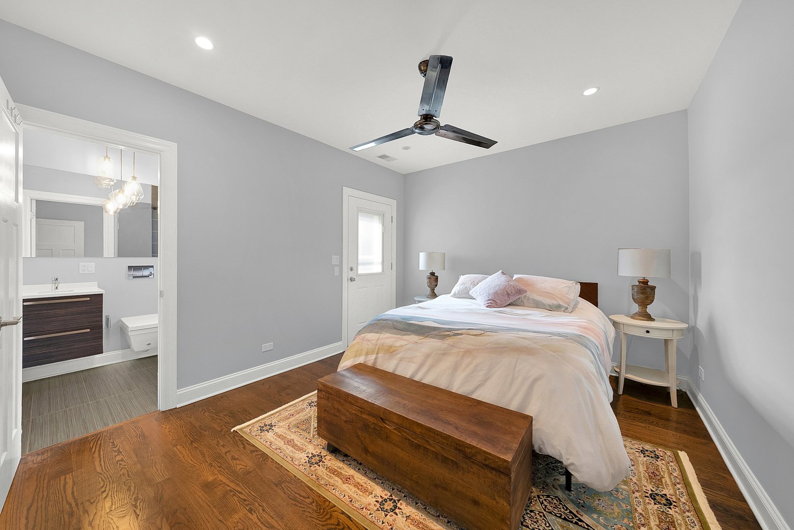 Undisclosed Address Chicago, IL 60647 - Photo 5 of 10 a bedroom with a bed and wooden floor