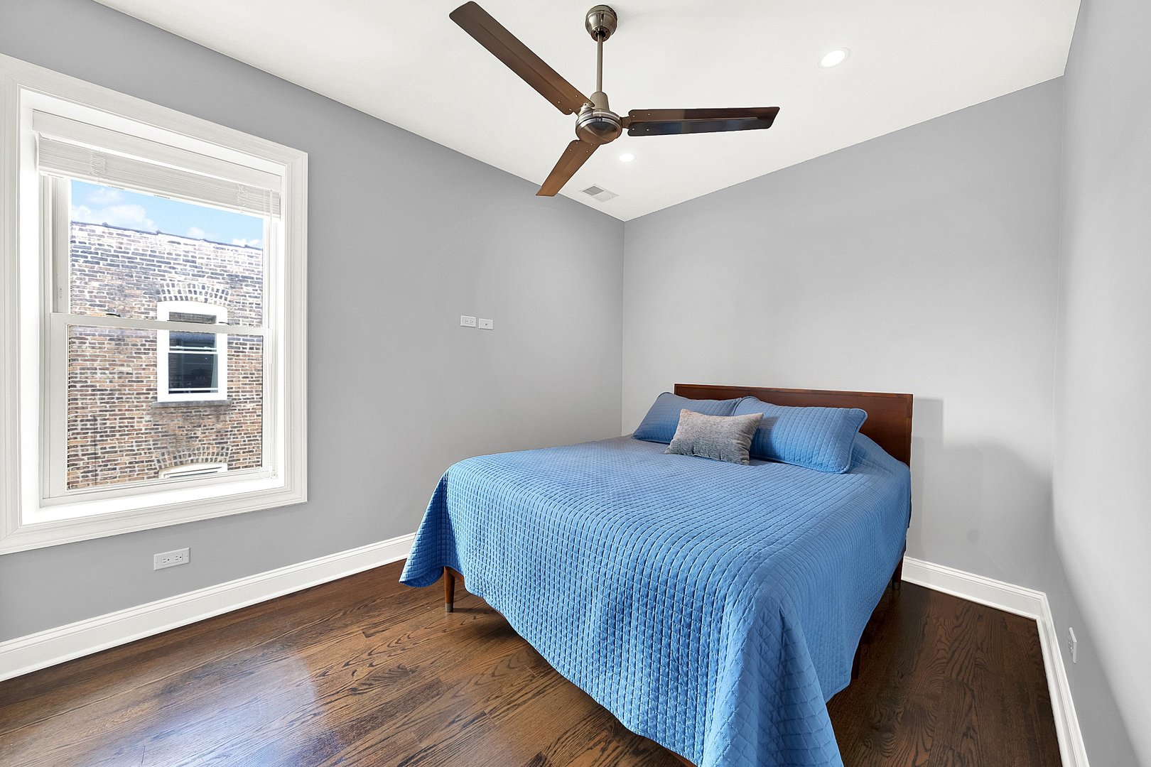 Undisclosed Address Chicago, IL 60647 - Photo 7 of 10 a bedroom with a bed and a window