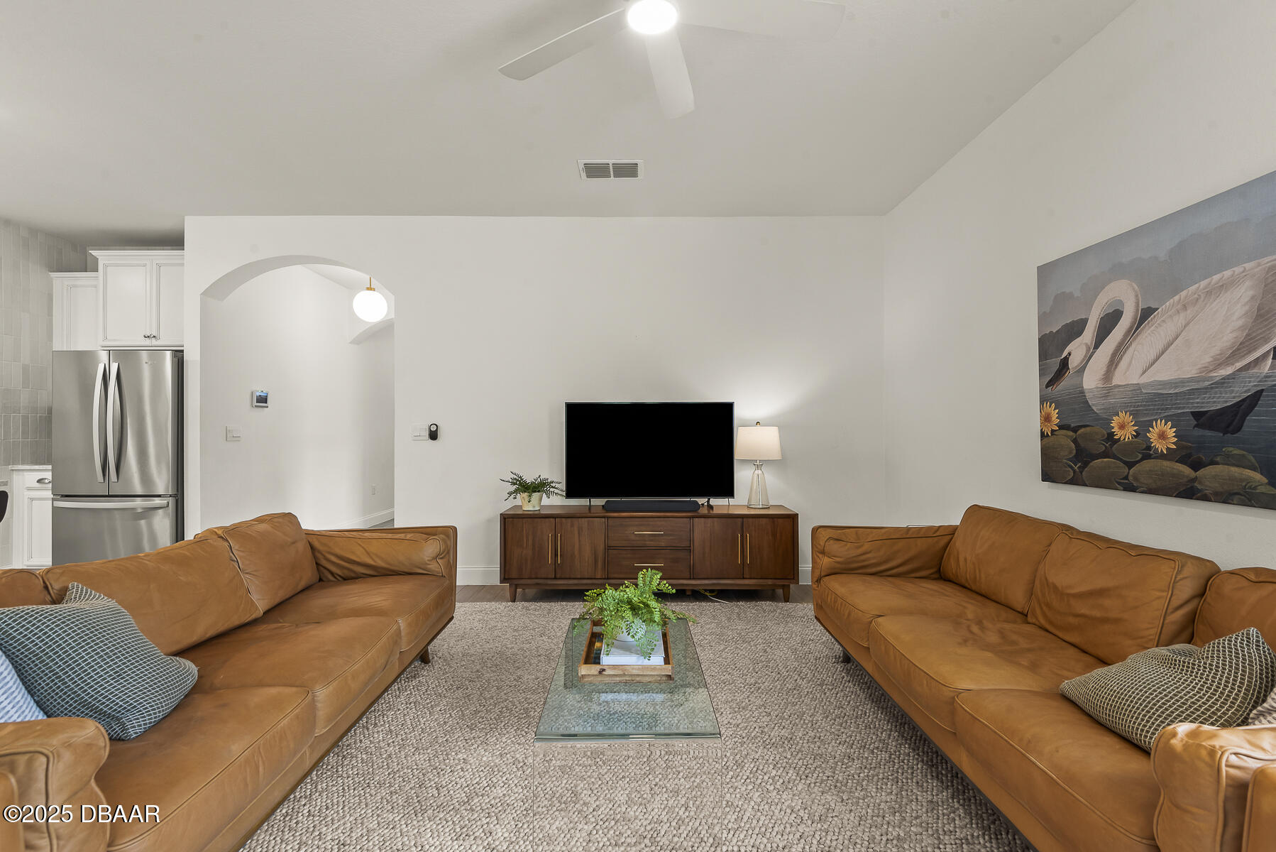 2853 Monaghan Drive Ormond Beach, FL 32174 - Photo 16 of 47 a living room with furniture and a flat screen tv