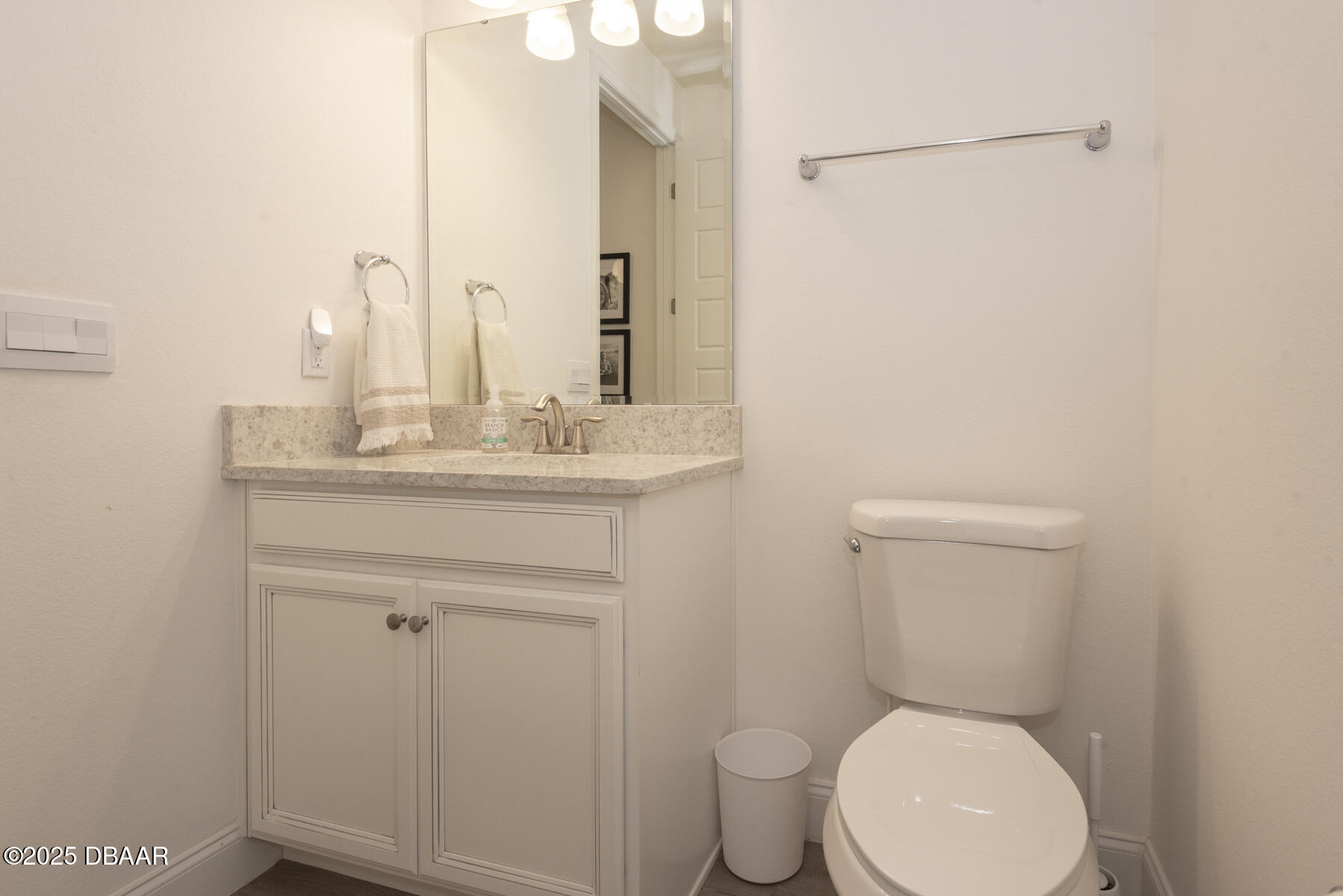2853 Monaghan Drive Ormond Beach, FL 32174 - Photo 23 of 47 a bathroom with a toilet sink and mirror
