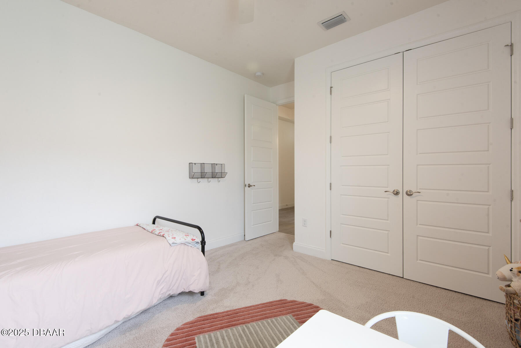 2853 Monaghan Drive Ormond Beach, FL 32174 - Photo 28 of 47 a bedroom with a bed and a dresser