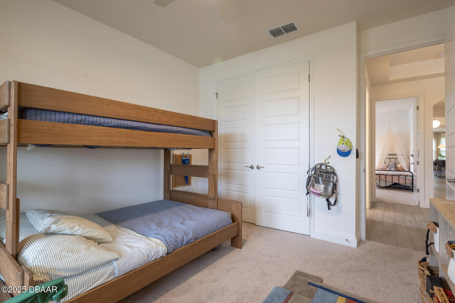 2853 Monaghan Drive Ormond Beach, FL 32174 - Photo 30 of 47 a bedroom with a bed and a mirror