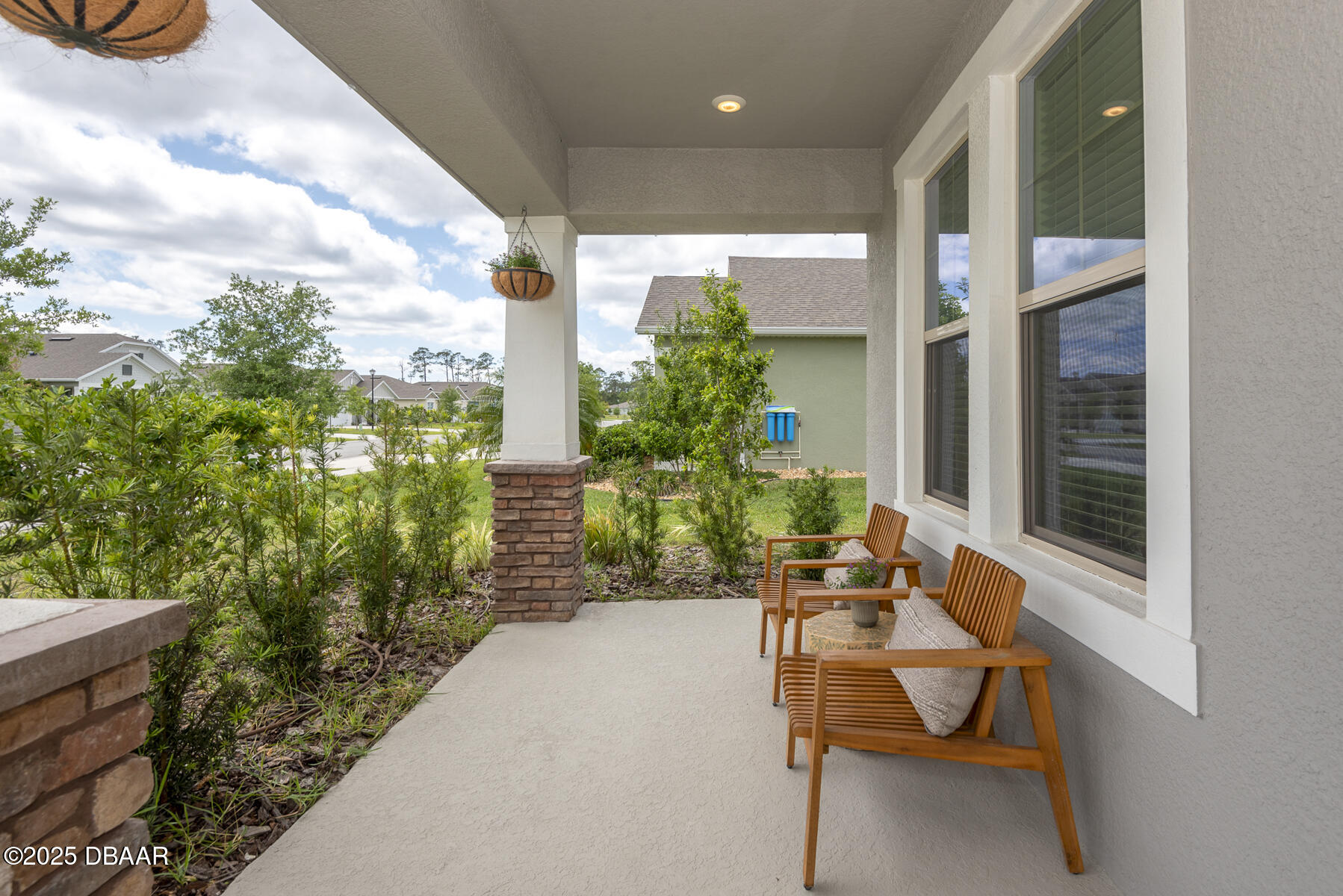 2853 Monaghan Drive Ormond Beach, FL 32174 - Photo 3 of 47 a balcony with chairs and potted plants