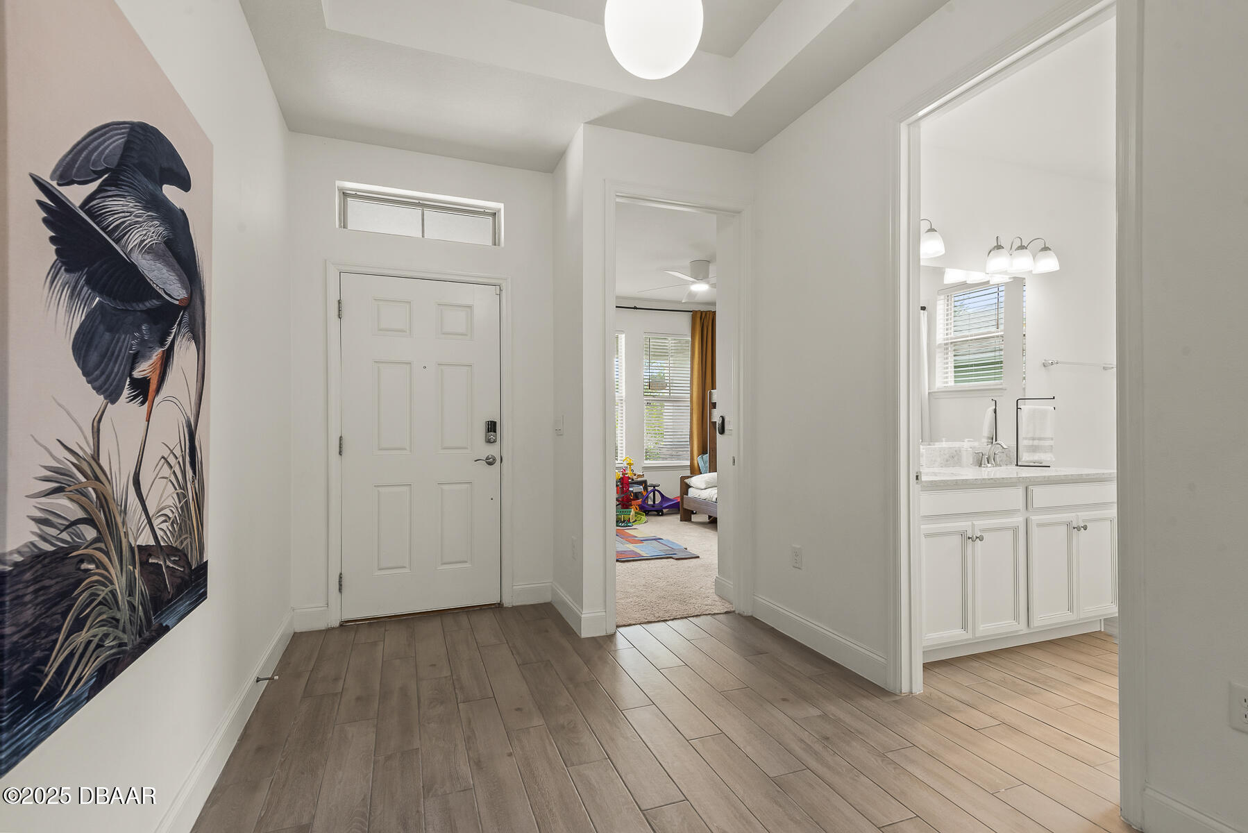 2853 Monaghan Drive Ormond Beach, FL 32174 - Photo 32 of 47 wooden floor with white cabinets
