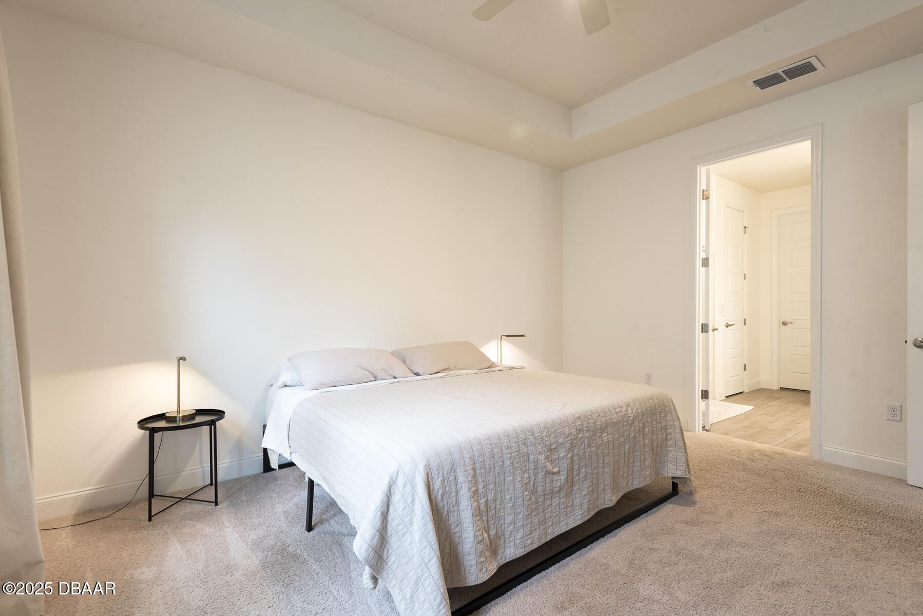 2853 Monaghan Drive Ormond Beach, FL 32174 - Photo 35 of 47 a bedroom with a bed and a night stand