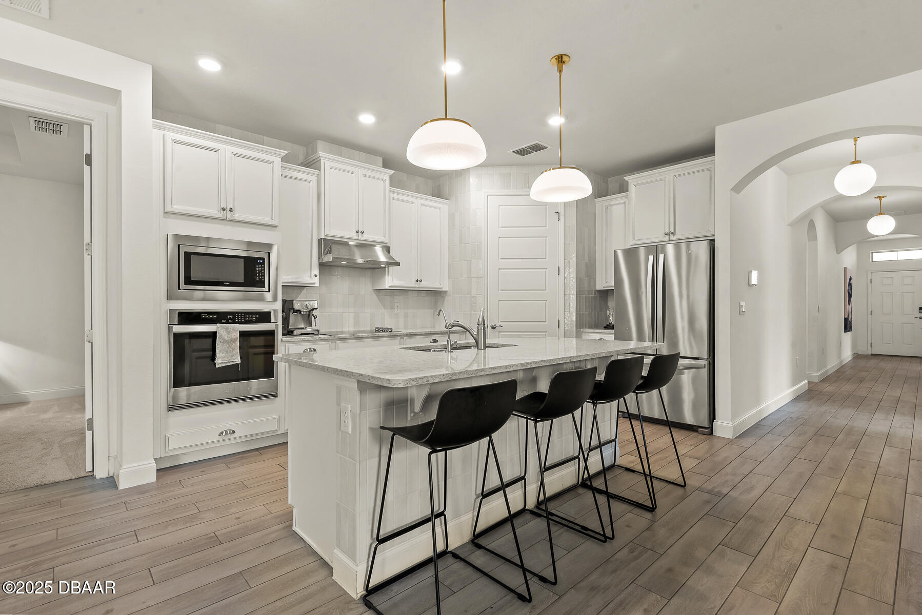 2853 Monaghan Drive Ormond Beach, FL 32174 - Photo 7 of 47 a kitchen with a counter space a sink appliances and cabinets