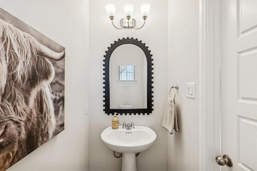 3236 Patrick Street Wylie, TX 75098 - Photo 14 of 35 a bathroom with a sink and a mirror