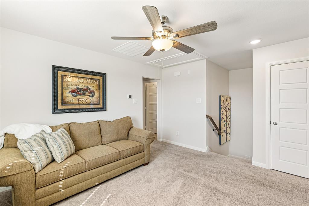 3236 Patrick Street Wylie, TX 75098 - Photo 20 of 35 a living room with furniture and a ceiling fan