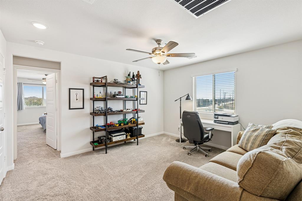 3236 Patrick Street Wylie, TX 75098 - Photo 21 of 35 a view of a livingroom with workspace and a couch