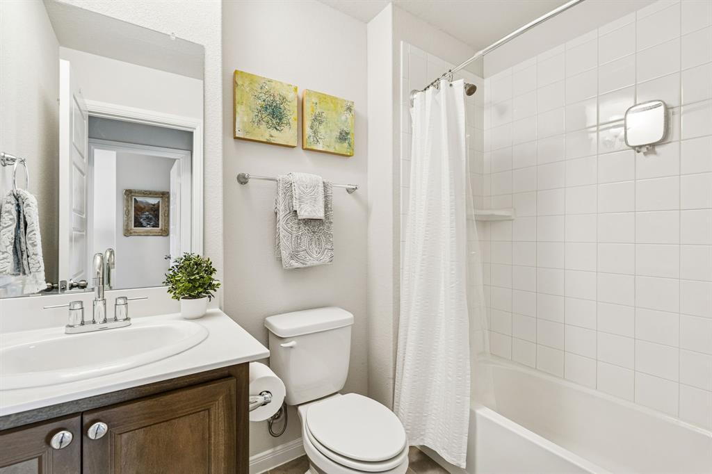 3236 Patrick Street Wylie, TX 75098 - Photo 26 of 35 a bathroom with a sink a toilet and shower