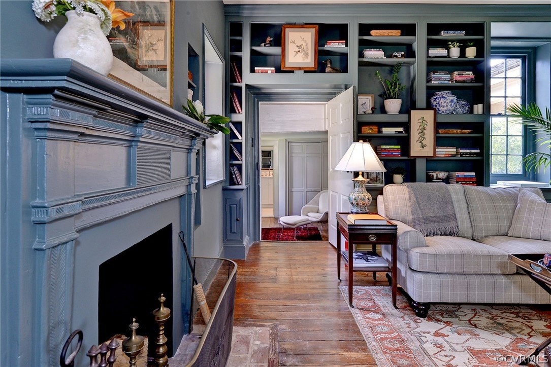 2459 Dunbrooke Road Tappahannock, VA 22560 - Photo 11 of 49 a living room with furniture and a fireplace