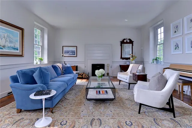 a living room with furniture and a fireplace