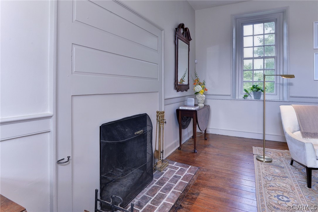 2459 Dunbrooke Road Tappahannock, VA 22560 - Photo 17 of 49 a living room with furniture and a fireplace