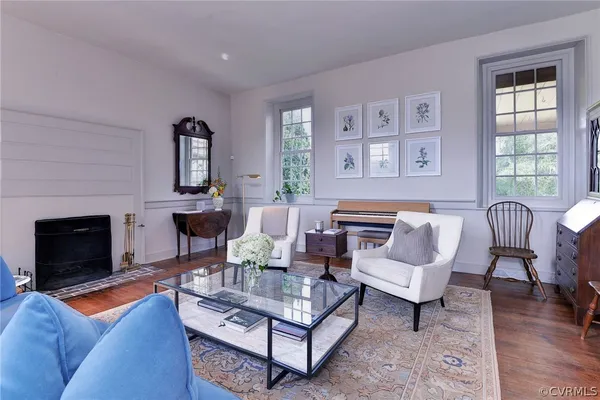 a living room with furniture and a rug