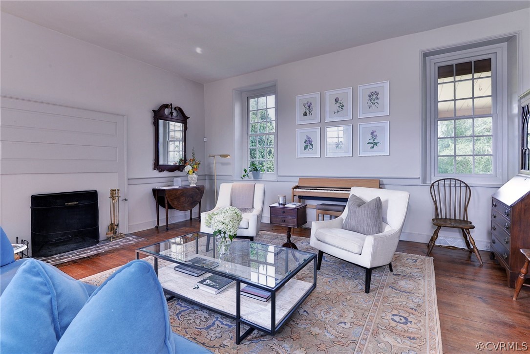 2459 Dunbrooke Road Tappahannock, VA 22560 - Photo 18 of 49 a living room with furniture a fireplace and a large window